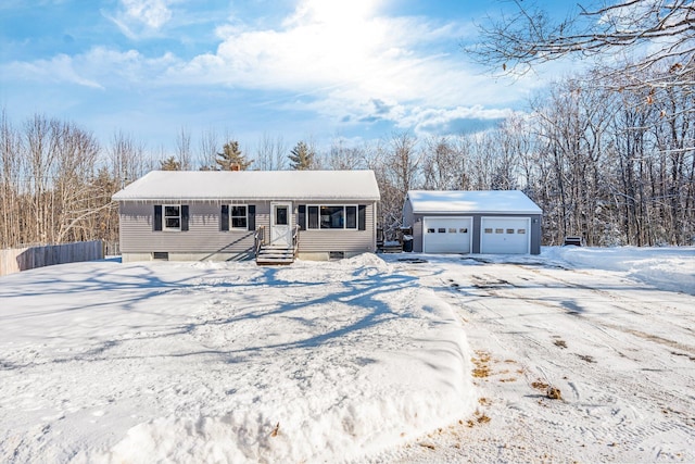 ranch-style house featuring an outbuilding and a garage