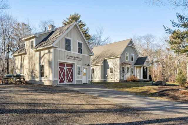 view of side of home with a yard