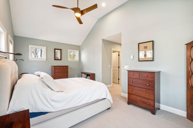 bedroom with ceiling fan, light colored carpet, and lofted ceiling