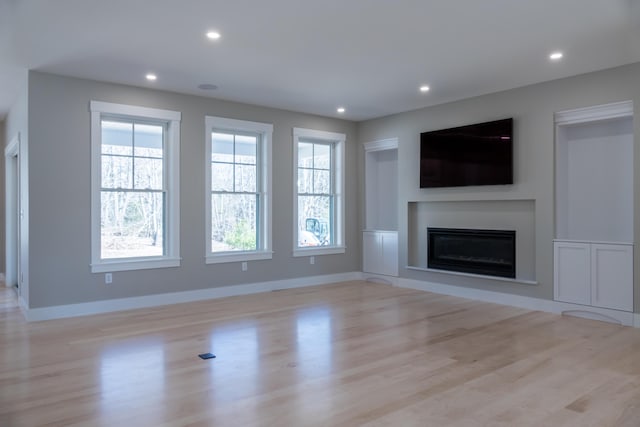 unfurnished living room featuring light hardwood / wood-style floors