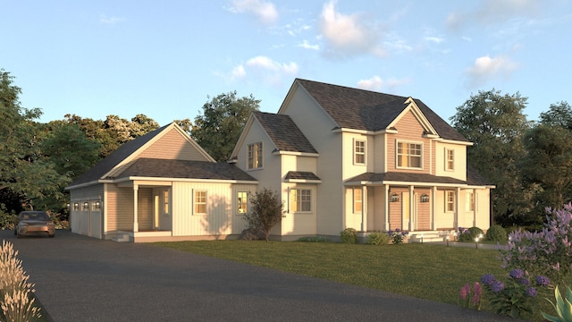 view of front facade featuring covered porch, a front lawn, and a garage