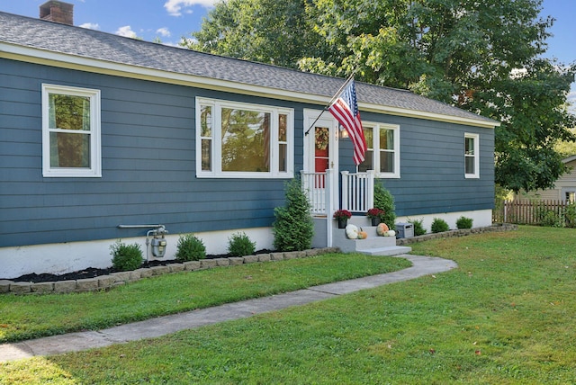 ranch-style house with a front lawn