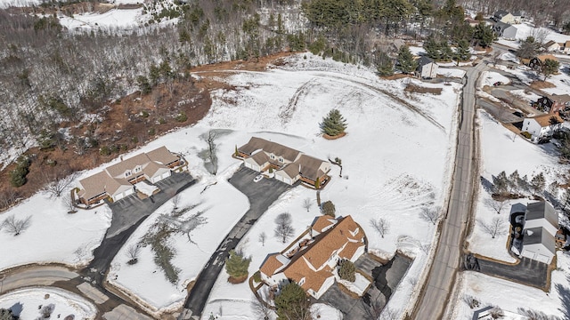 snowy aerial view with a residential view