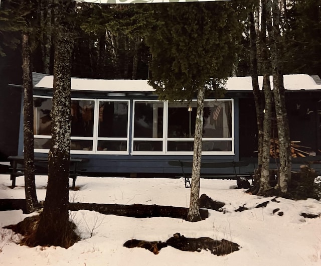 view of snow covered property