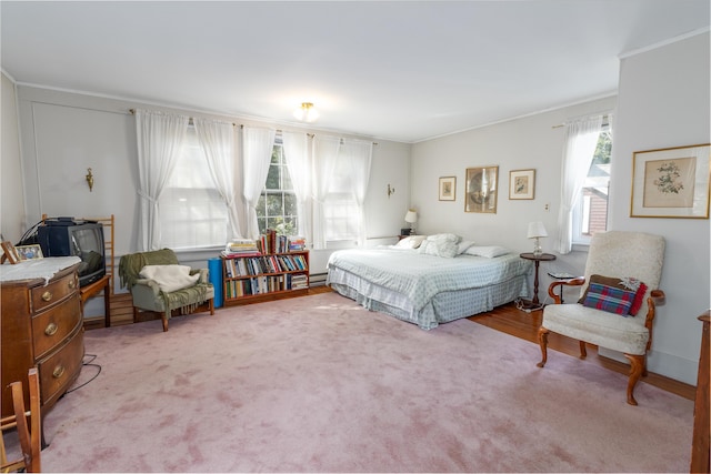 carpeted bedroom featuring ornamental molding