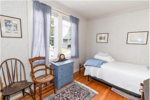 bedroom with hardwood / wood-style floors