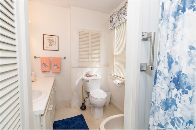 bathroom with walk in shower, a bidet, vanity, and toilet