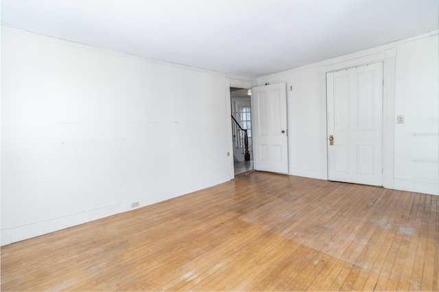 empty room featuring hardwood / wood-style flooring