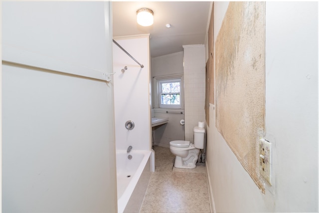 bathroom with shower / bathing tub combination and toilet