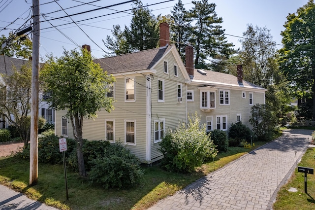 view of home's exterior with a lawn