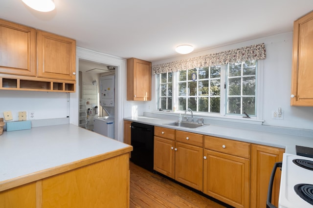 kitchen with sink, electric range oven, stacked washing maching and dryer, black dishwasher, and light hardwood / wood-style floors