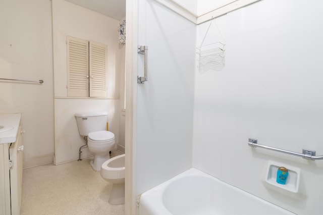 bathroom featuring a bidet, vanity, and toilet