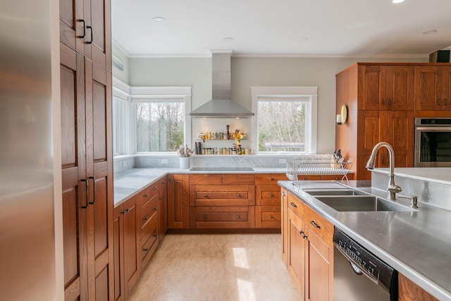 kitchen with wall chimney exhaust hood, a sink, stainless steel appliances, plenty of natural light, and ornamental molding