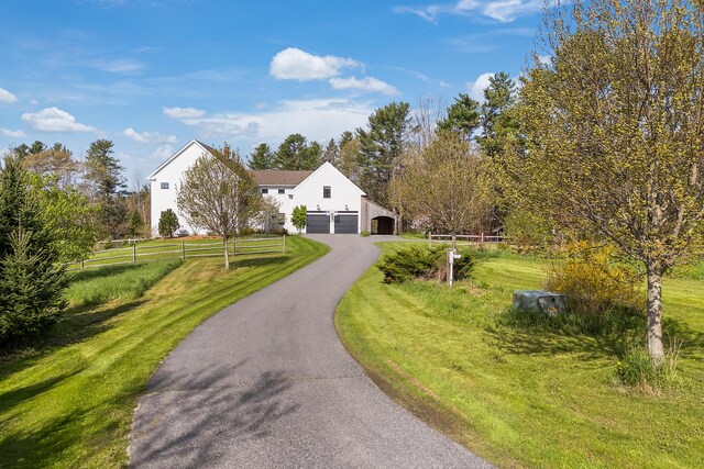 view of front of house with asphalt driveway