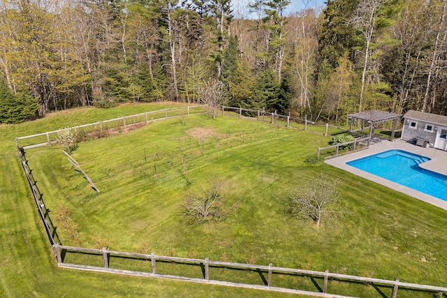 view of swimming pool with an outbuilding and a patio area