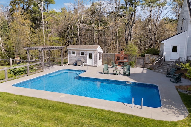 view of swimming pool featuring a pergola, an outdoor structure, a patio, a storage structure, and fence