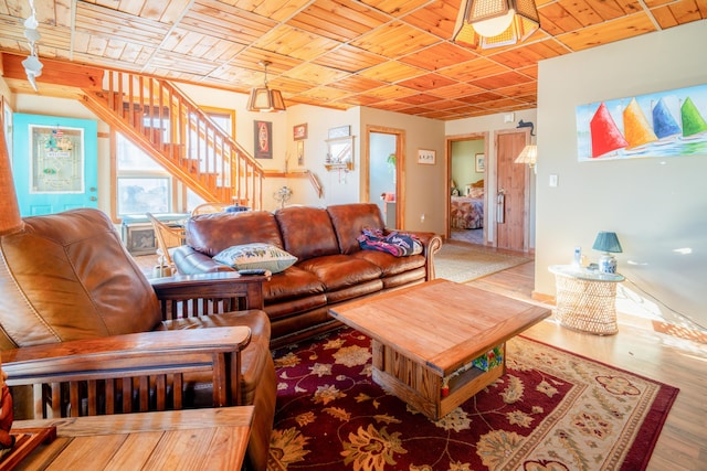 living room featuring wood ceiling and hardwood / wood-style flooring