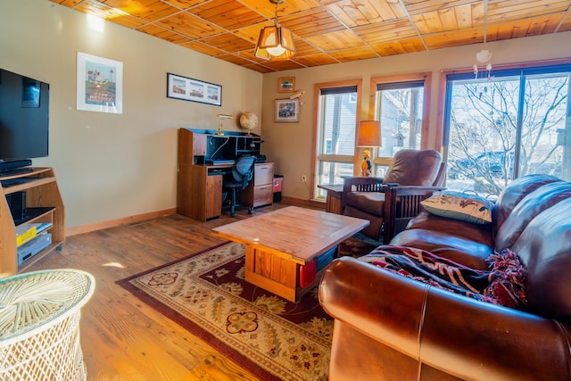 living room featuring hardwood / wood-style flooring and wood ceiling