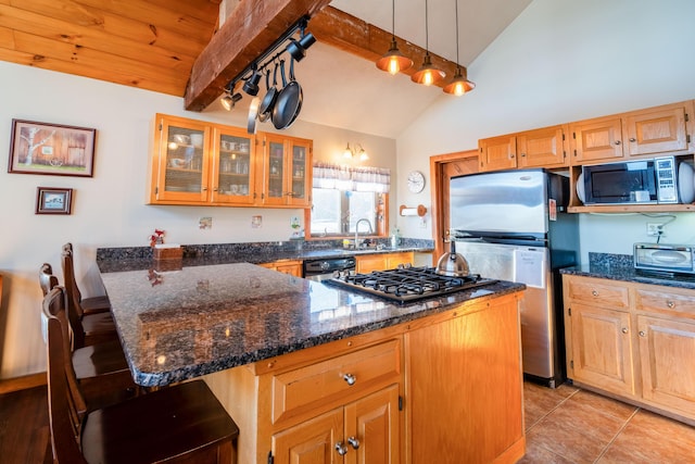 kitchen featuring a breakfast bar, dark stone countertops, beam ceiling, high vaulted ceiling, and black appliances