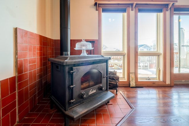 room details with hardwood / wood-style flooring and a wood stove