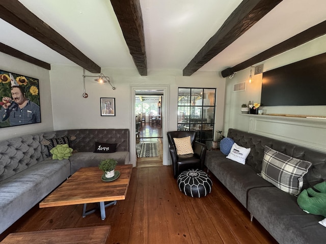 living room with beamed ceiling and dark hardwood / wood-style floors