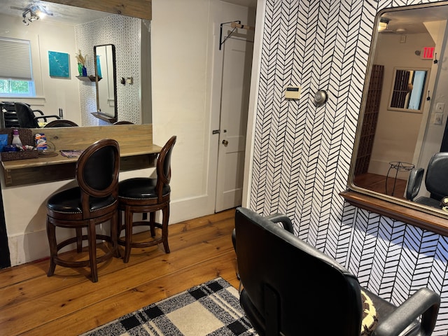 home office with wood-type flooring