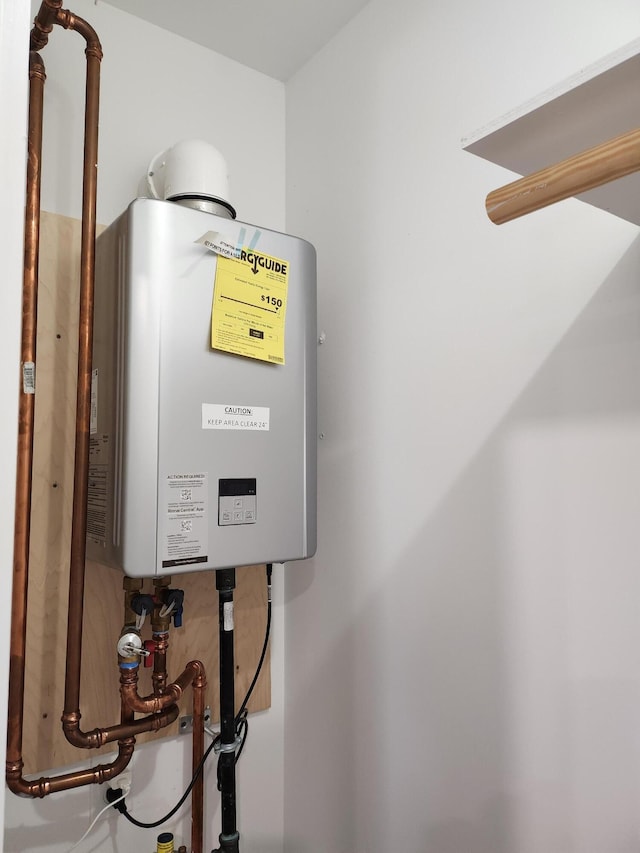 utility room with water heater