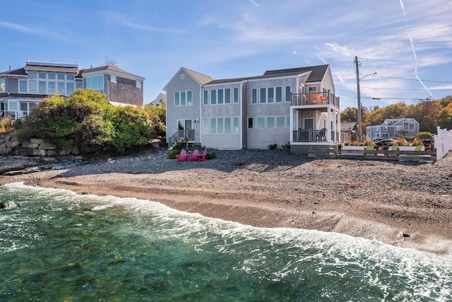 back of house featuring a water view