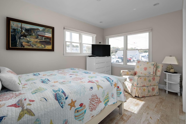 bedroom with light hardwood / wood-style flooring