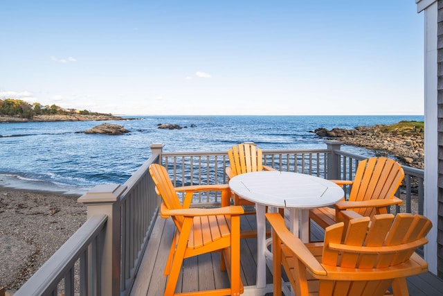 balcony with a view of the beach and a water view