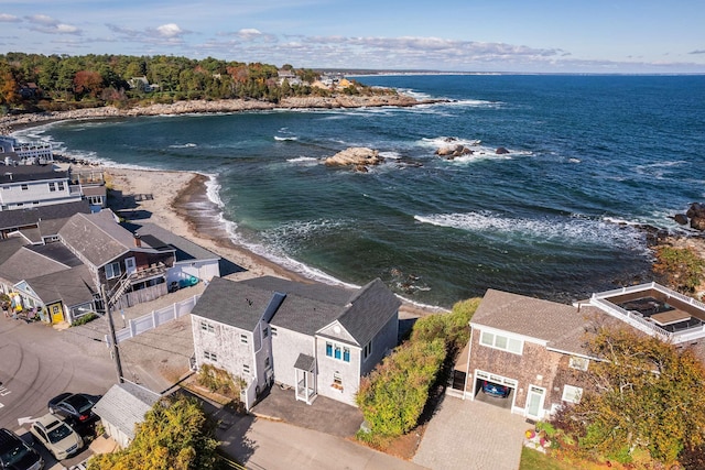 birds eye view of property featuring a water view and a view of the beach