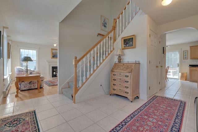 staircase featuring tile patterned flooring