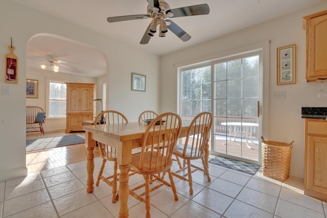 dining area featuring ceiling fan and light tile patterned floors