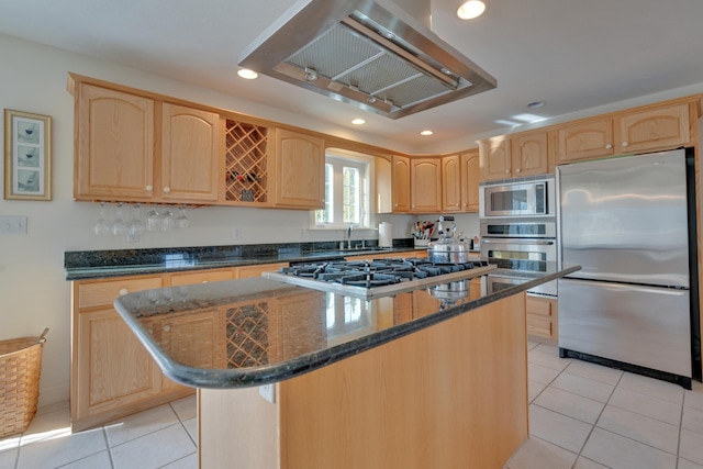 kitchen featuring wall chimney range hood, a center island, stainless steel appliances, and light tile patterned flooring