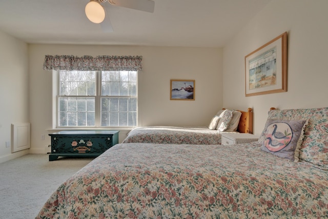 bedroom with ceiling fan and carpet