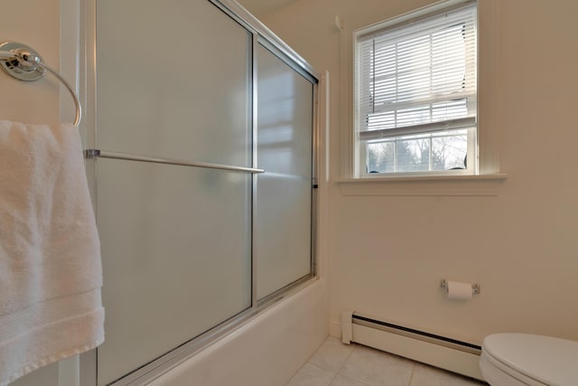 bathroom featuring a baseboard radiator, tile patterned flooring, combined bath / shower with glass door, and a healthy amount of sunlight