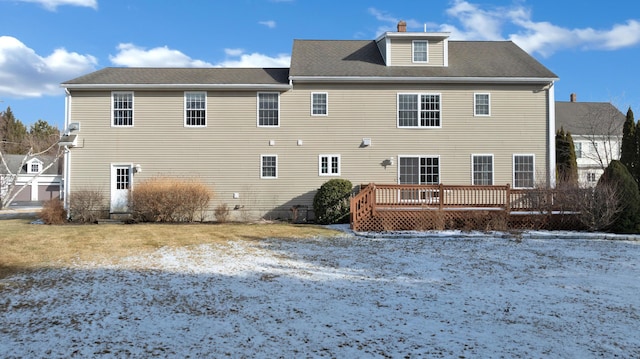 rear view of property with a wooden deck