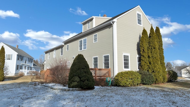 view of home's exterior featuring a deck