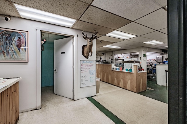 interior space featuring a drop ceiling