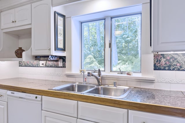 kitchen with sink, white cabinetry, tasteful backsplash, and dishwasher