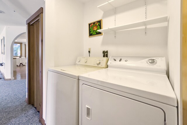 washroom featuring carpet floors and separate washer and dryer