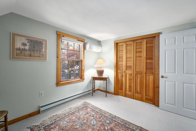 carpeted bedroom featuring baseboard heating, a wall mounted AC, lofted ceiling, and a closet