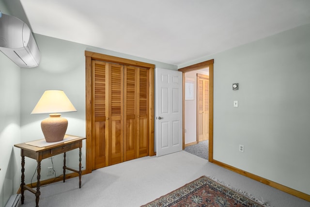 carpeted bedroom featuring a baseboard heating unit, a closet, and an AC wall unit