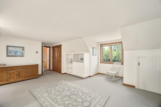 carpeted bedroom featuring vaulted ceiling