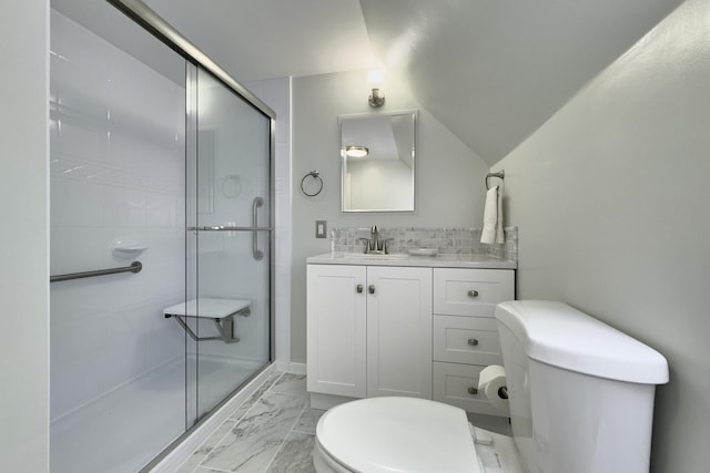 bathroom with vaulted ceiling, toilet, decorative backsplash, a shower with door, and vanity