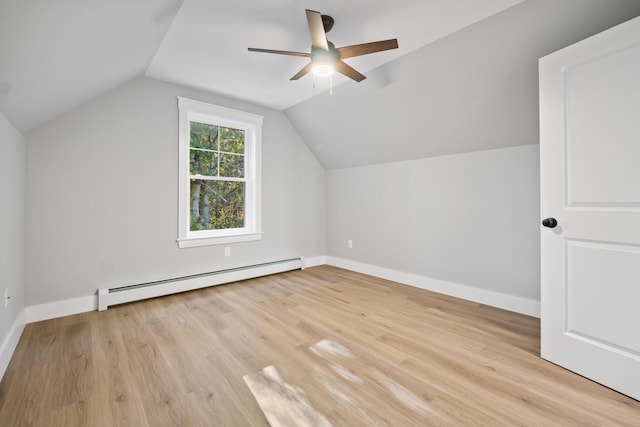 bonus room featuring lofted ceiling, ceiling fan, a baseboard radiator, and light hardwood / wood-style flooring