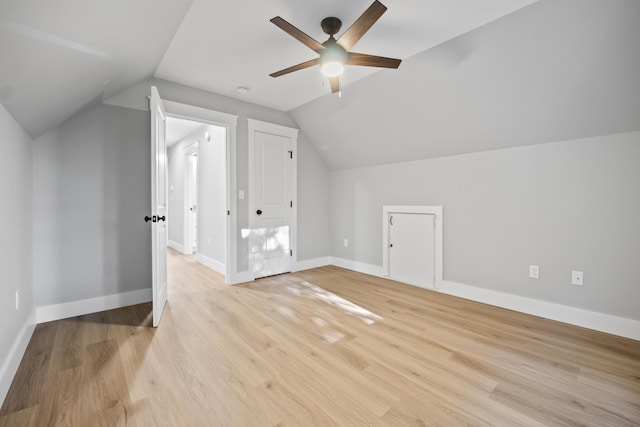 bonus room featuring ceiling fan, light wood-type flooring, and lofted ceiling