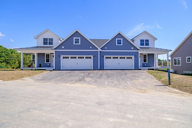 view of front facade featuring a porch and a garage