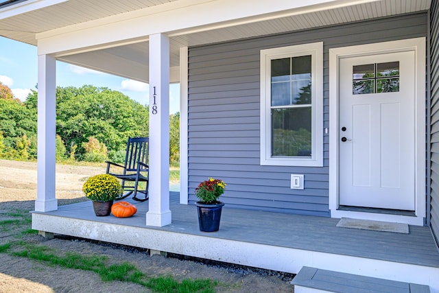 property entrance with covered porch