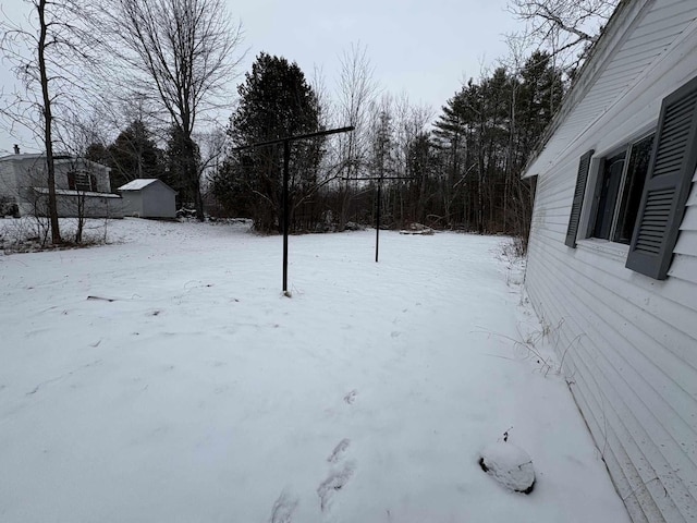 view of yard covered in snow